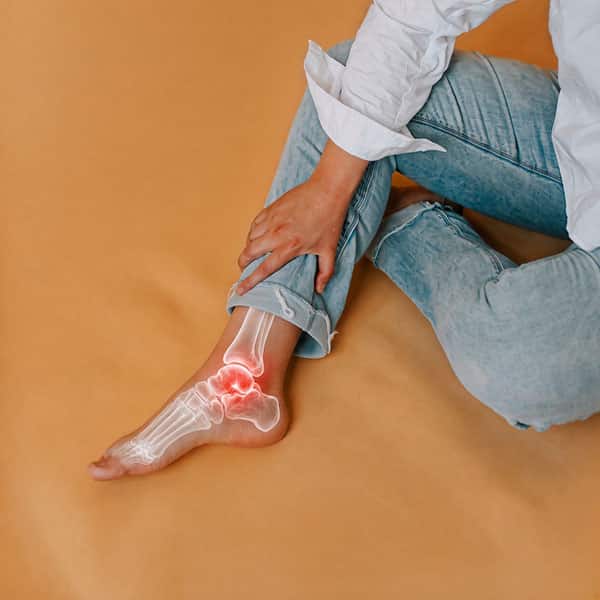 Close-up of an ankle during a bodywork session